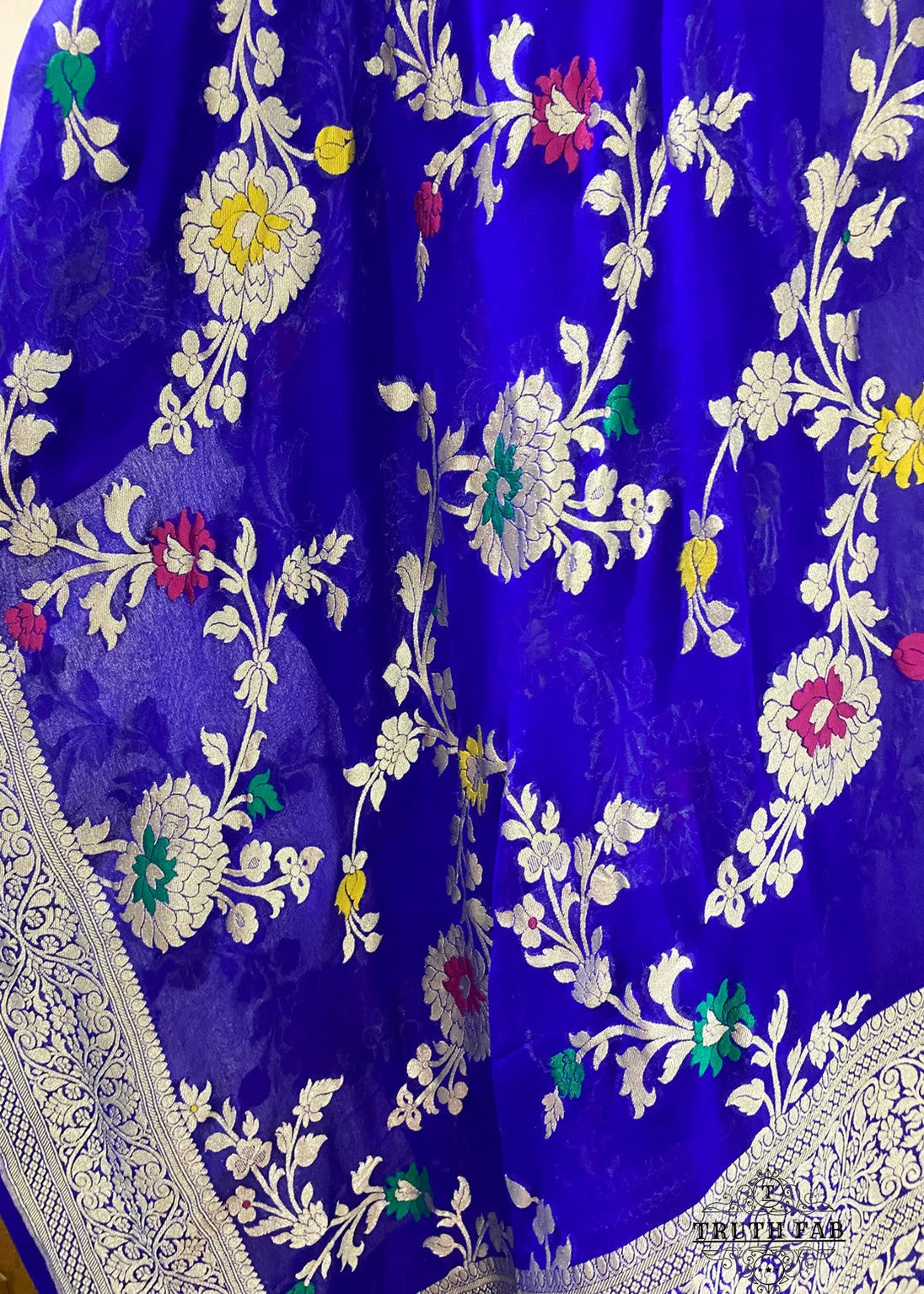 A stunning  pink Banarasi dupatta. The authentic Meenakari jaal work with golden zari handwoven in the finest chiffon georgettes. It takes around 4-5 days to weave this rich and luxurious piece of our tradition.