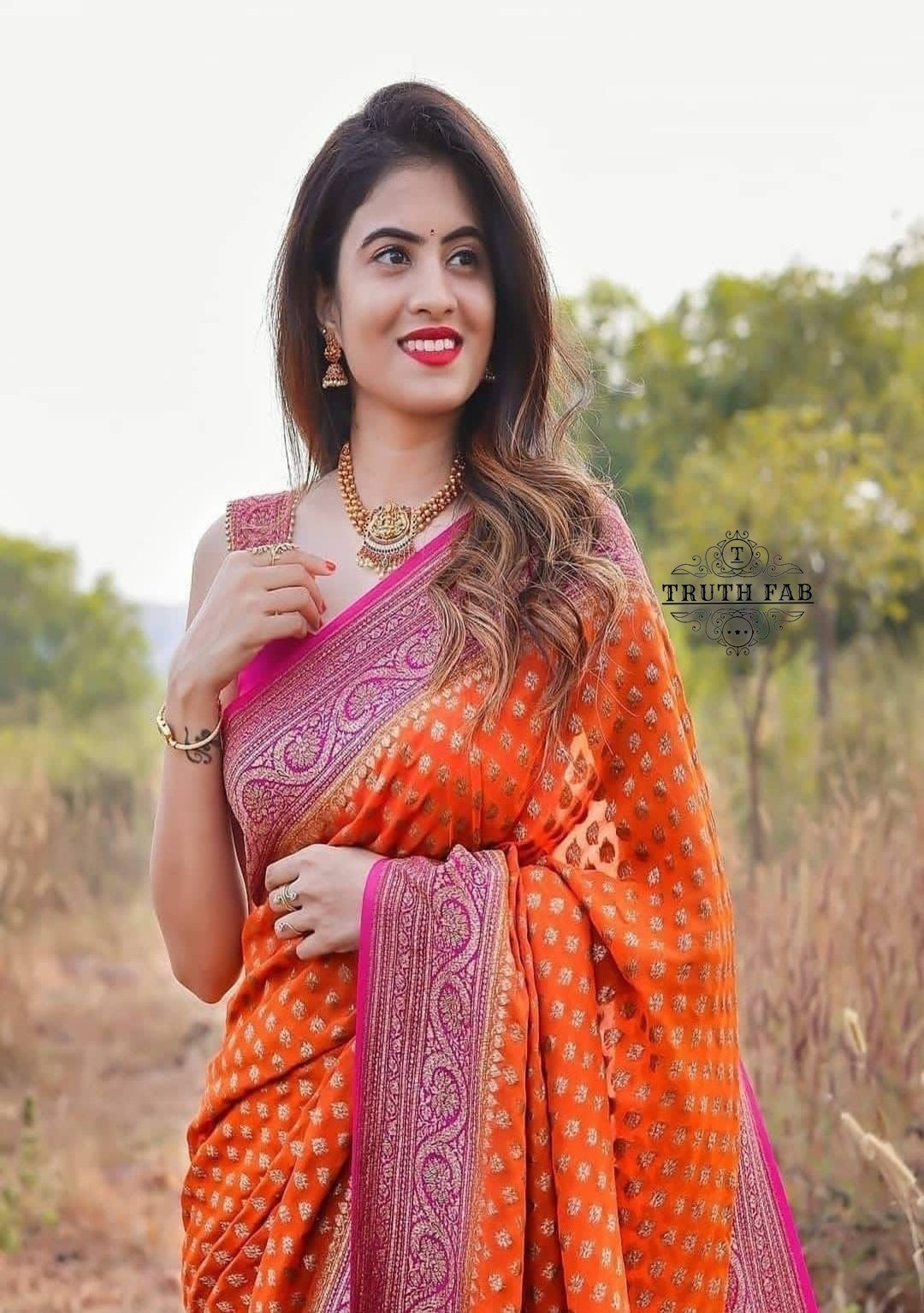 Handloom banarasi georgette saree in orange color with antique zari work