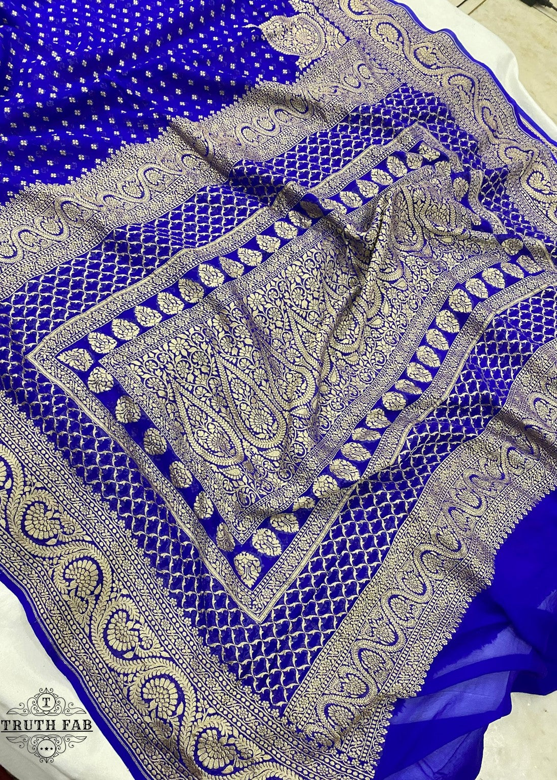 Handloom banarasi georgette saree in blue color with antique zari work