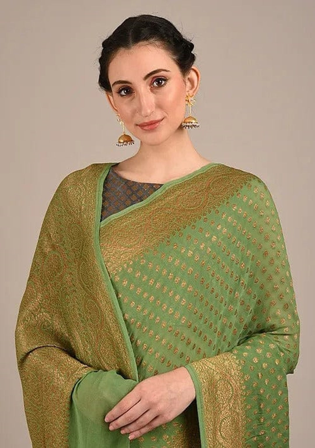 Khaddi georgette saree in apple green color with antique zari work