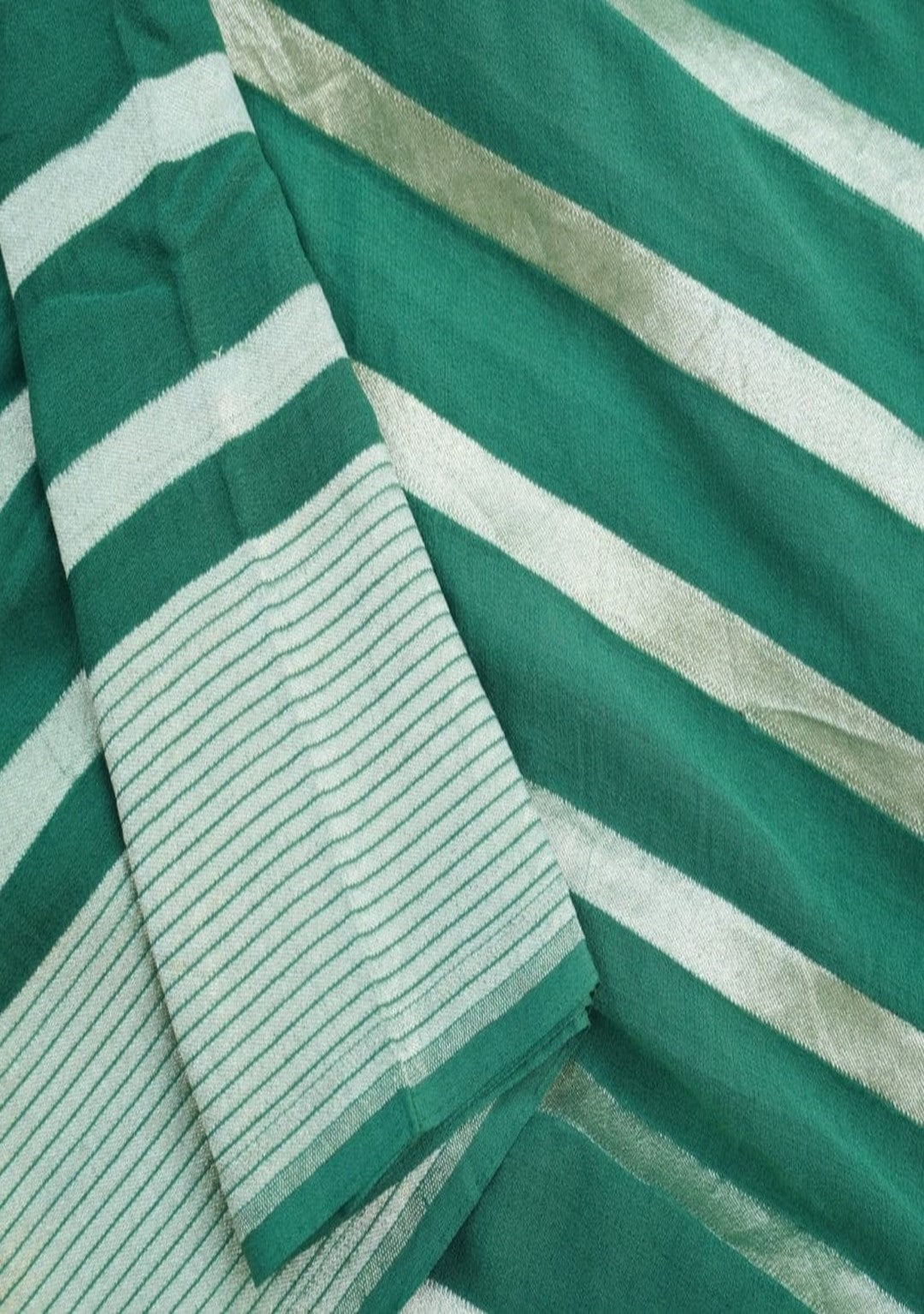 Khaddi handloom saree in green color with water zari work
