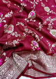 Georgette khaddi saree in mahroon colour. Saree has a delicate water zari border with Gorgeous unique Motifs near pallu. The entire saree is beautiful with water zari meenakari design. It is an elegant traditional Banarasi saree. Irresistible wedding collection. This Mesmerising Saree is a Combination of Elegance and Style.