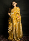 Tussar Georgette khaddi saree yellow colour. Saree has a delicate water zari border with Gorgeous unique Motifs near pallu. The entire saree is beautiful with water zari meenakari design. It is an elegant traditional Banarasi saree. Irresistible wedding collection. This Mesmerising Saree is a Combination of Elegance and Style.