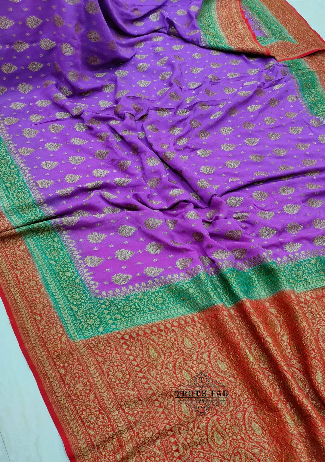Banarasi georgette handloom saree in magenta color with antique zari work