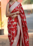 Georgette khaddi saree red colour. Saree has a delicate water zari border with Gorgeous unique Motifs near pallu. The entire saree is beautiful with water zari meenakari design. It is an elegant traditional Banarasi saree. Irresistible wedding collection. This Mesmerising Saree is a Combination of Elegance and Style.
