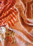 Pure handloom chiffon meenakari saree with neem zari design in orange color. Saree has a delicate chiffon meenakari zari border with Gorgeous unique Motifs near pallu. The entire saree is beautiful with neem zari design. It is an elegant traditional Banarasi saree. Irresistible wedding collection. This Mesmerising Saree is a Combination of Elegance and Style.