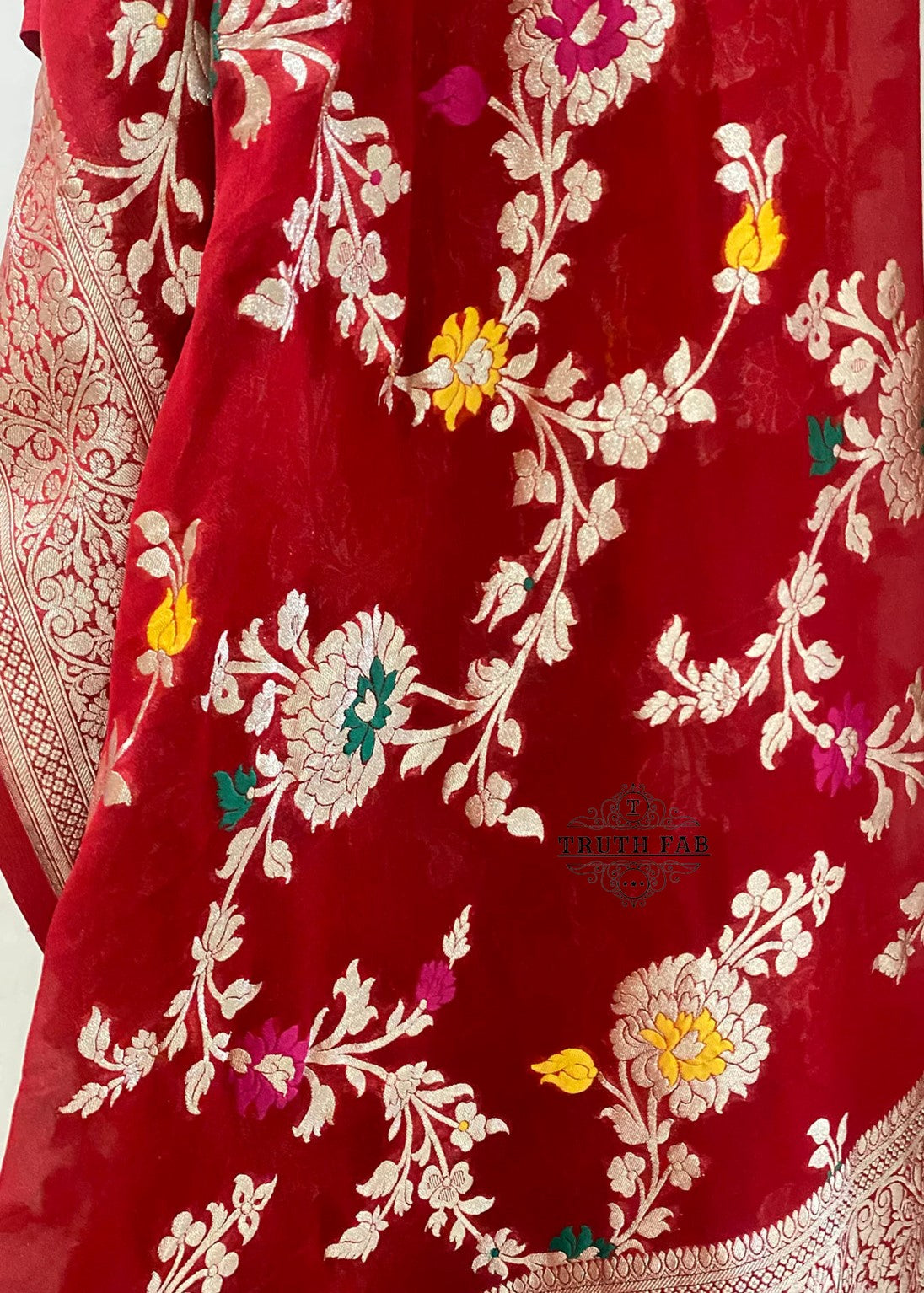 A stunning  pink Banarasi dupatta. The authentic Meenakari jaal work with golden zari handwoven in the finest chiffon georgettes. It takes around 4-5 days to weave this rich and luxurious piece of our tradition.